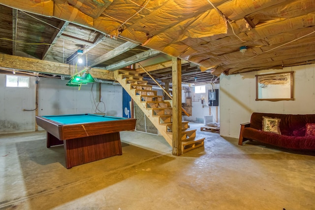 rec room featuring concrete floors, a healthy amount of sunlight, billiards, and electric panel