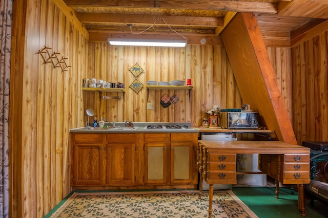 interior space featuring a sink and wooden walls