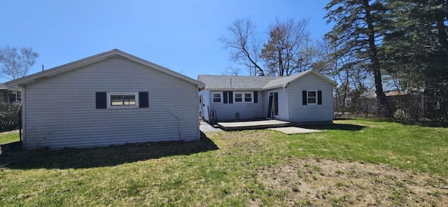 rear view of house featuring a yard and a wooden deck