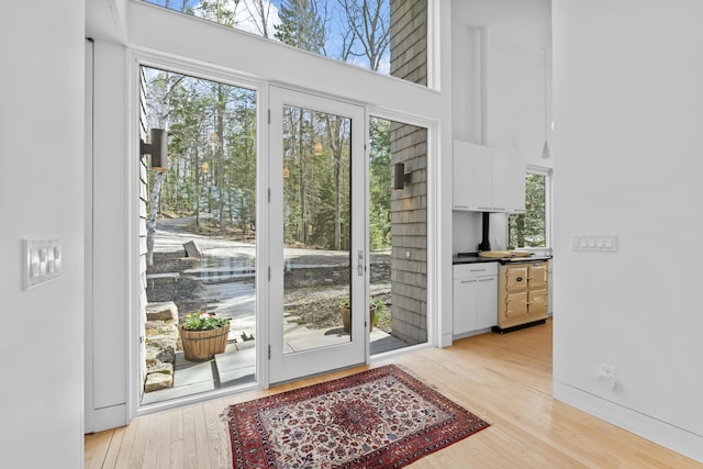 27 Carter Dr, West Bath, ME 04530 - entryway with light wood-style flooring and a high ceiling