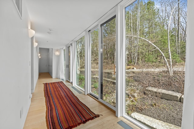 27 Carter Dr, West Bath, ME 04530 - unfurnished sunroom featuring a wall of windows and wood finished floors