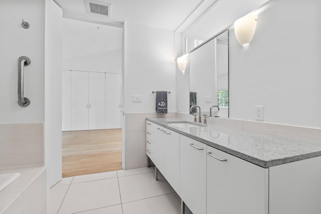 27 Carter Dr, West Bath, ME 04530 - full bathroom with tile patterned flooring, vanity, visible vents, and a washtub