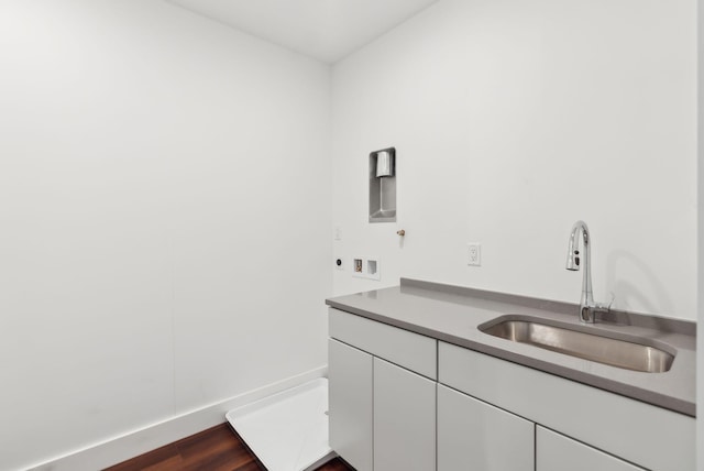 130 Morning St Unit 3A, Portland, ME 04101 - washroom with cabinet space, hookup for a washing machine, and dark wood-type flooring