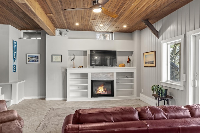 37 Harpswell Islands Rd, Harpswell, ME 04079 - tiled living room featuring a glass covered fireplace, wooden ceiling, ceiling fan, and a wealth of natural light