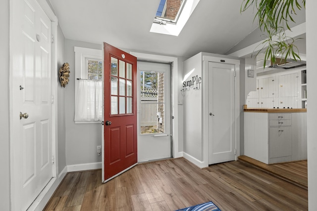 37 Harpswell Islands Rd, Harpswell, ME 04079 - interior space with baseboards, wood finished floors, and a skylight