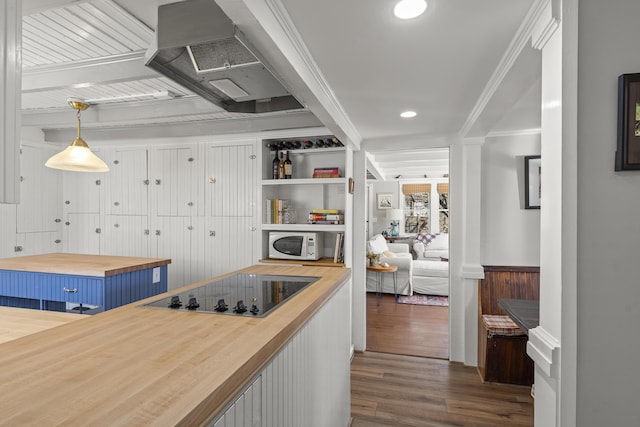 37 Harpswell Islands Rd, Harpswell, ME 04079 - kitchen featuring butcher block counters, white microwave, black electric stovetop, blue cabinets, and dark wood finished floors