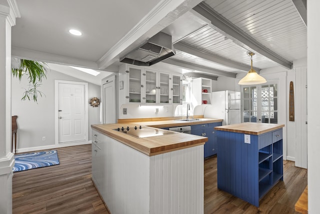 37 Harpswell Islands Rd, Harpswell, ME 04079 - kitchen with open shelves, butcher block counters, freestanding refrigerator, and blue cabinetry