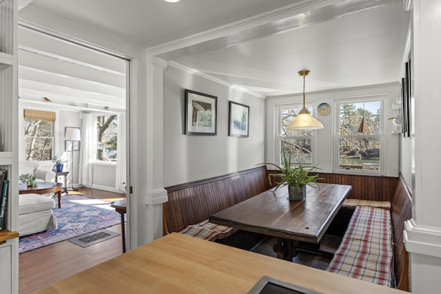 37 Harpswell Islands Rd, Harpswell, ME 04079 - dining area with a wainscoted wall, plenty of natural light, ornamental molding, and wood finished floors