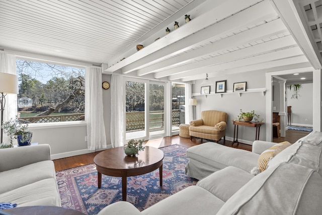 37 Harpswell Islands Rd, Harpswell, ME 04079 - living room with beamed ceiling, baseboards, and wood finished floors