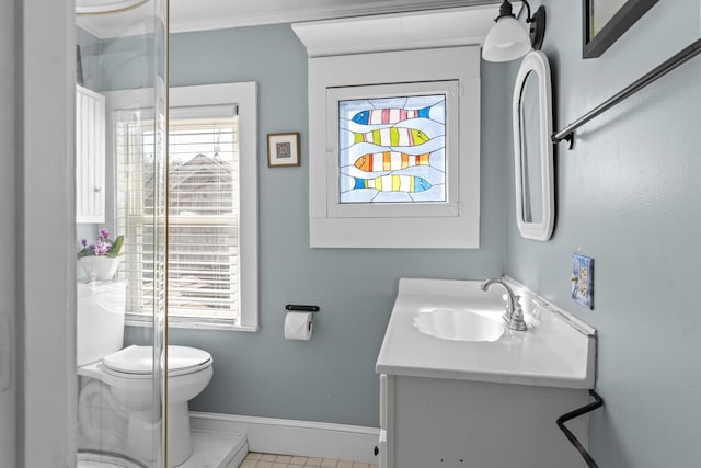 37 Harpswell Islands Rd, Harpswell, ME 04079 - bathroom with crown molding, vanity, toilet, baseboards, and plenty of natural light