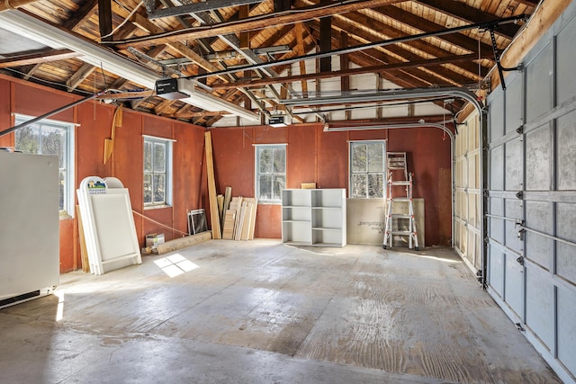 37 Harpswell Islands Rd, Harpswell, ME 04079 - garage featuring freestanding refrigerator and a garage door opener