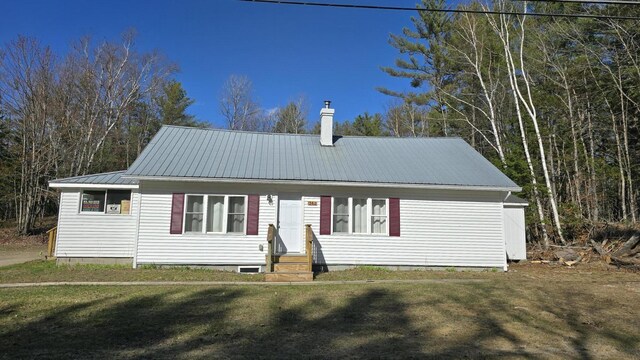 341 E Andover Rd, Andover, ME 04226 - view of front of home with a chimney, metal roof, entry steps, and a front lawn