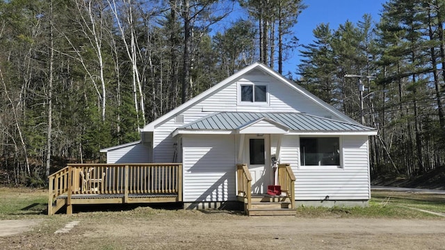 341 E Andover Rd, Andover, ME 04226 - view of front of property with a deck and metal roof