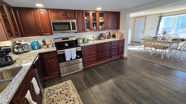 341 E Andover Rd, Andover, ME 04226 - kitchen with light stone counters, dark wood finished floors, stainless steel appliances, recessed lighting, and glass insert cabinets