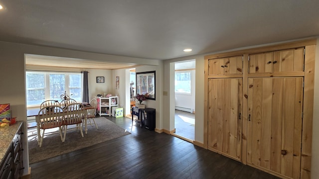 341 E Andover Rd, Andover, ME 04226 - dining area featuring recessed lighting, dark wood finished floors, a wealth of natural light, and a baseboard heating unit