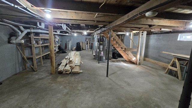 341 E Andover Rd, Andover, ME 04226 - below grade area featuring stairway and gas water heater