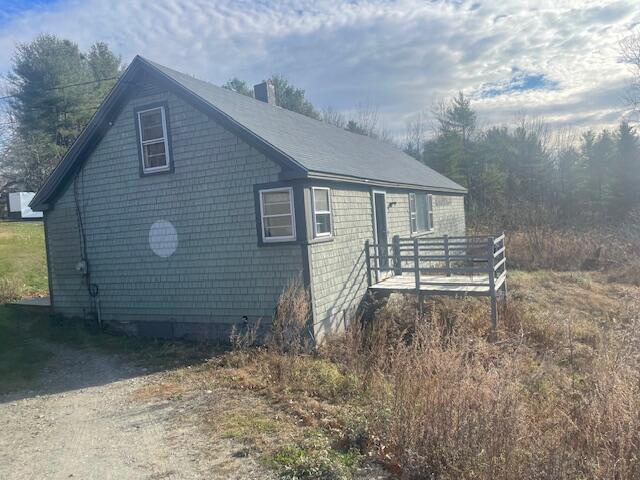 405 Pond Rd, Sidney, ME 04330 - view of side of home featuring a wooden deck and a chimney