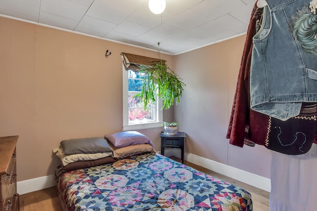 405 Pond Rd, Sidney, ME 04330 - bedroom featuring baseboards, crown molding, and wood finished floors