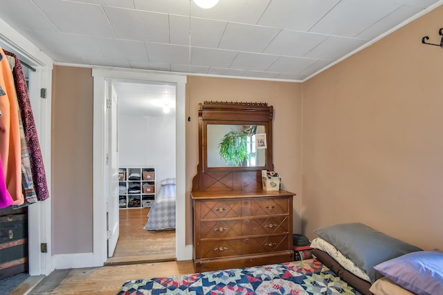 405 Pond Rd, Sidney, ME 04330 - bedroom featuring ornamental molding and wood finished floors
