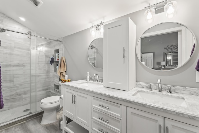 164 Hotel Rd, Auburn, ME 04210 - bathroom with visible vents, a sink, a stall shower, and toilet