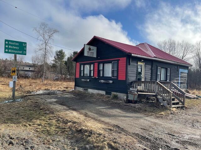 387 Main St, Mattawamkeag, ME 04459 - view of front of home featuring metal roof