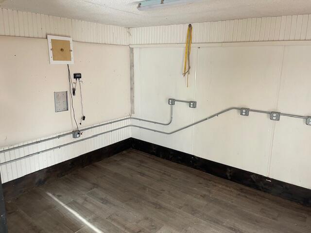 387 Main St, Mattawamkeag, ME 04459 - below grade area with dark wood finished floors