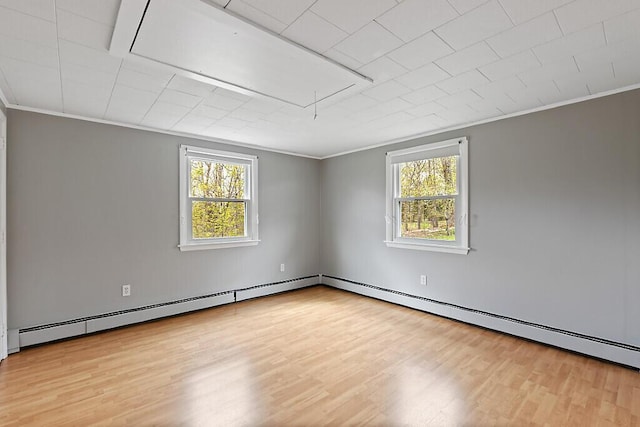 222 Ward Rd, Augusta, ME 04330 - empty room with attic access, plenty of natural light, wood finished floors, and crown molding