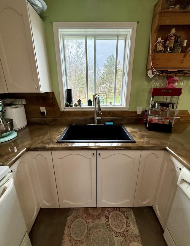 12 Grace Snow Dr, Glenburn, ME 04401 - kitchen featuring a sink, white cabinetry, white dishwasher, and range