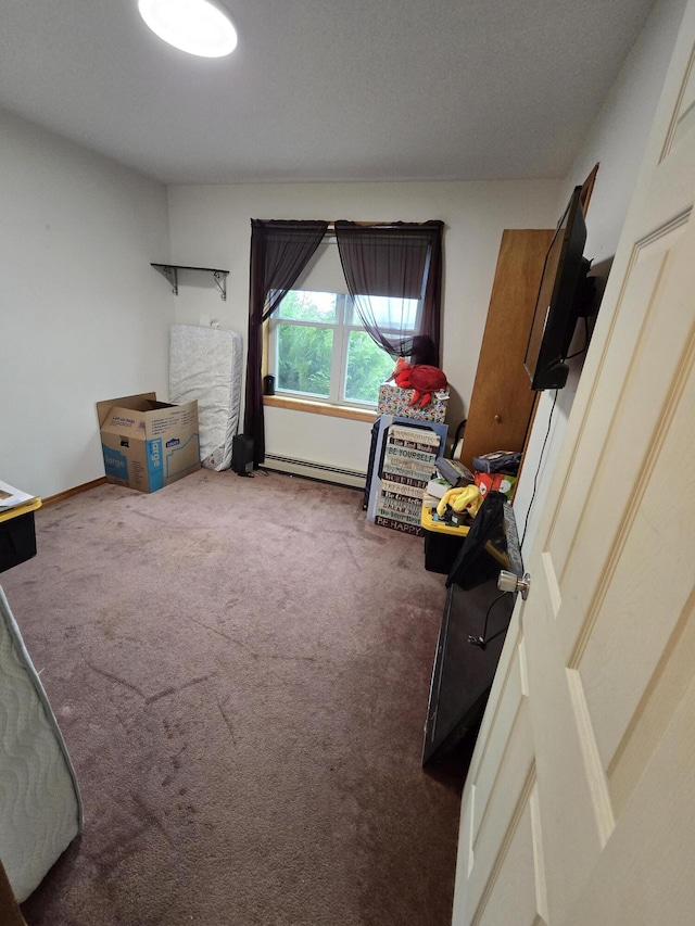 12 Grace Snow Dr, Glenburn, ME 04401 - bedroom featuring a baseboard heating unit, carpet flooring, and baseboards