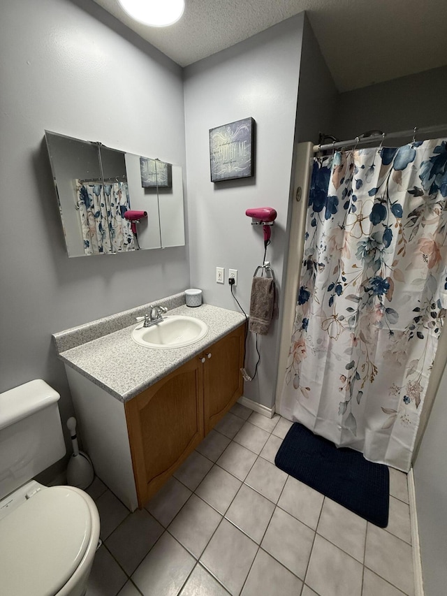 12 Grace Snow Dr, Glenburn, ME 04401 - full bathroom with toilet, tile patterned flooring, vanity, curtained shower, and a textured ceiling