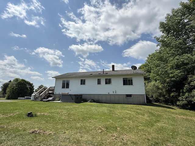 12 Grace Snow Dr, Glenburn, ME 04401 - back of property with stairway and a yard