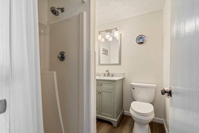 1373 Post Rd Unit 4A, Wells, ME 04090 - bathroom featuring vanity, wood finished floors, toilet, baseboards, and a shower with shower curtain