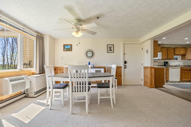 1373 Post Rd Unit 4A, Wells, ME 04090 - dining area featuring light carpet, an AC wall unit, recessed lighting, a textured ceiling, and a ceiling fan
