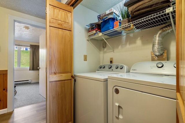 1373 Post Rd Unit 4A, Wells, ME 04090 - laundry area featuring laundry area, washer and dryer, a textured ceiling, a baseboard radiator, and light wood finished floors