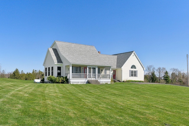 61 Pond Rd, Albion, ME 04910 - view of front facade with a shingled roof, a porch, and a front yard