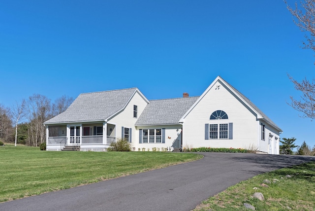 61 Pond Rd, Albion, ME 04910 - view of front facade with a shingled roof, a front lawn, aphalt driveway, and a chimney