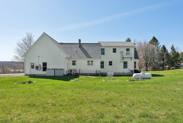 61 Pond Rd, Albion, ME 04910 - back of property featuring a shingled roof, a yard, and a chimney