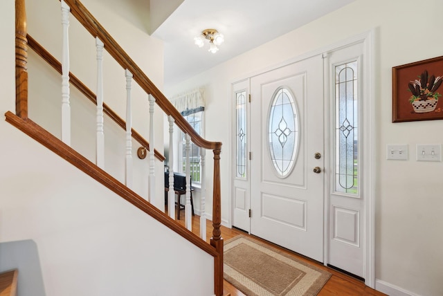 61 Pond Rd, Albion, ME 04910 - foyer featuring stairs, baseboards, and wood finished floors