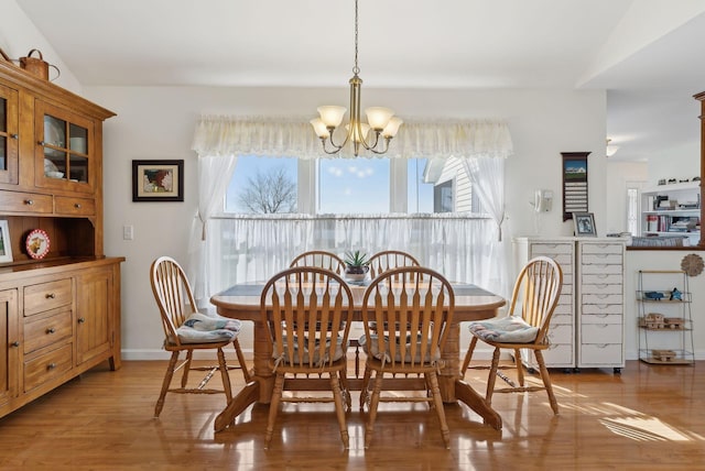 61 Pond Rd, Albion, ME 04910 - dining area featuring light wood finished floors and a notable chandelier