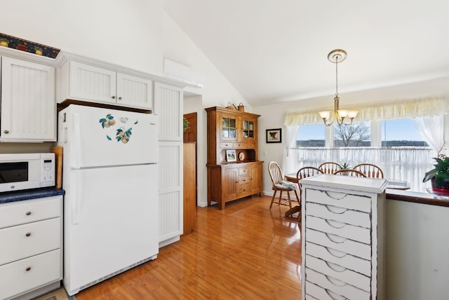 61 Pond Rd, Albion, ME 04910 - kitchen featuring white appliances, high vaulted ceiling, a chandelier, light wood-style flooring, and white cabinetry
