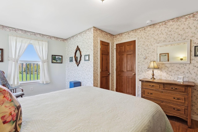 61 Pond Rd, Albion, ME 04910 - bedroom featuring wallpapered walls and wood finished floors