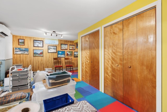 61 Pond Rd, Albion, ME 04910 - interior space with wood walls and a wall mounted air conditioner