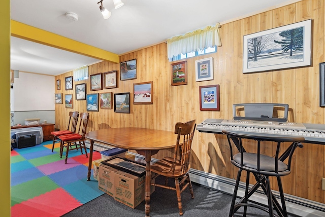 61 Pond Rd, Albion, ME 04910 - carpeted dining space featuring wood walls and a baseboard radiator