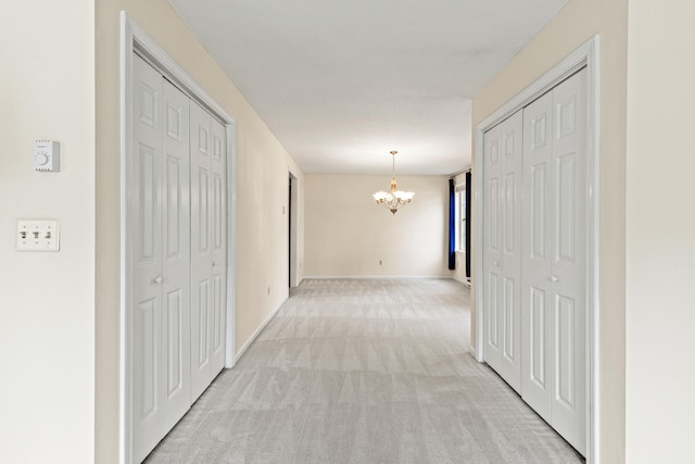 161 Saco Ave Unit 404, Old Orchard Beach, ME 04064 - corridor with a chandelier and light carpet
