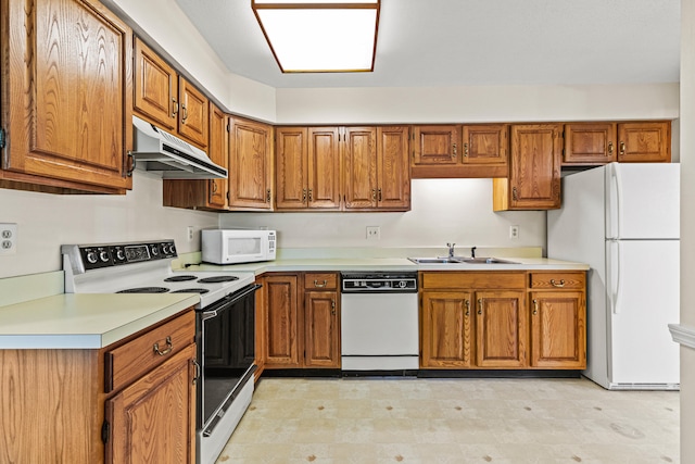 161 Saco Ave Unit 404, Old Orchard Beach, ME 04064 - kitchen with white appliances, a sink, under cabinet range hood, and brown cabinetry