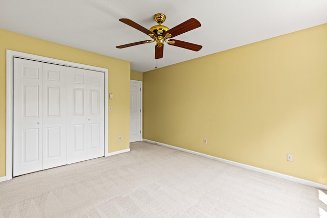 161 Saco Ave Unit 404, Old Orchard Beach, ME 04064 - unfurnished bedroom featuring light carpet, a closet, baseboards, and a ceiling fan