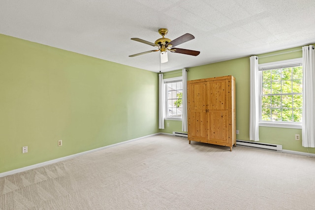 161 Saco Ave Unit 404, Old Orchard Beach, ME 04064 - carpeted spare room with a baseboard heating unit, ceiling fan, and baseboards