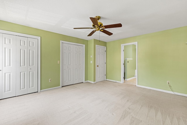 161 Saco Ave Unit 404, Old Orchard Beach, ME 04064 - unfurnished bedroom with two closets, carpet floors, baseboards, and ensuite bath