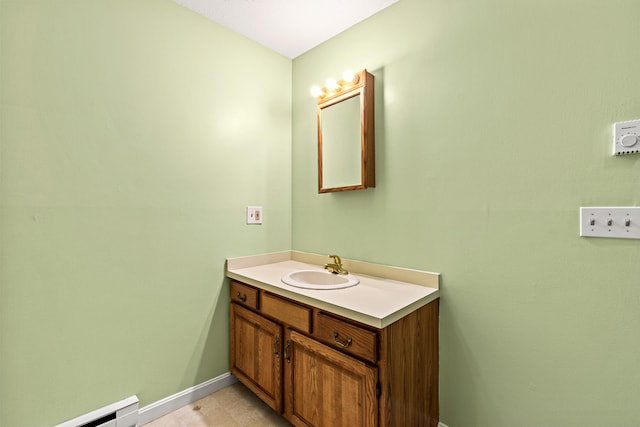 161 Saco Ave Unit 404, Old Orchard Beach, ME 04064 - bathroom featuring baseboard heating, vanity, and baseboards