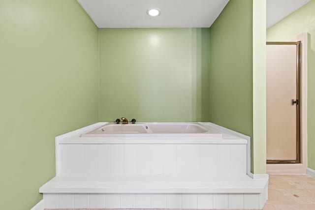 161 Saco Ave Unit 404, Old Orchard Beach, ME 04064 - bathroom with a stall shower, a bath, baseboards, and tile patterned floors
